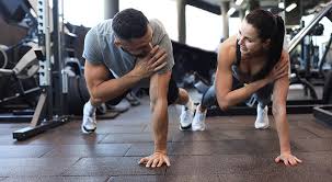 Toning Bingo Wings: Your Ultimate Guide to Sculpting Sleek Arms at the Gym 3 Fitness trainer demonstrating arm toning exercises Redhill