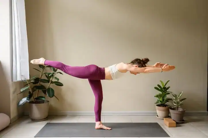 Achieving the Perfect Tone: How Often Should You Exercise for Results? 1 Woman doing Yoga exercise Redhill to help with toning the body.